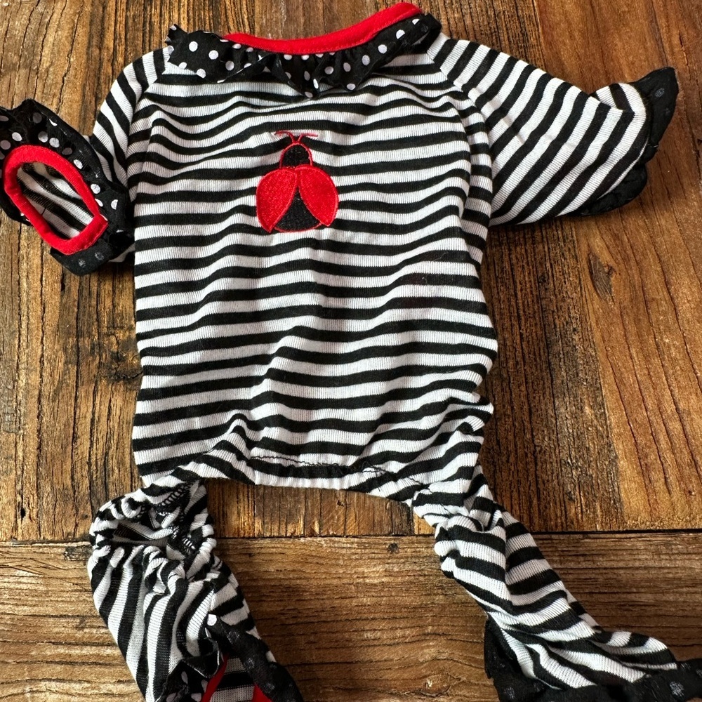 Black and White Striped Dog Onesie with Red Accents